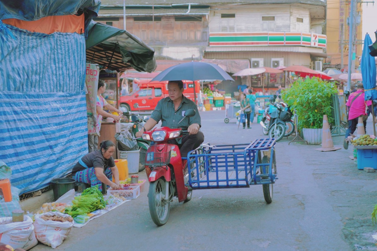 Hongdae street vendor market with colorful food stalls and bustling crowd