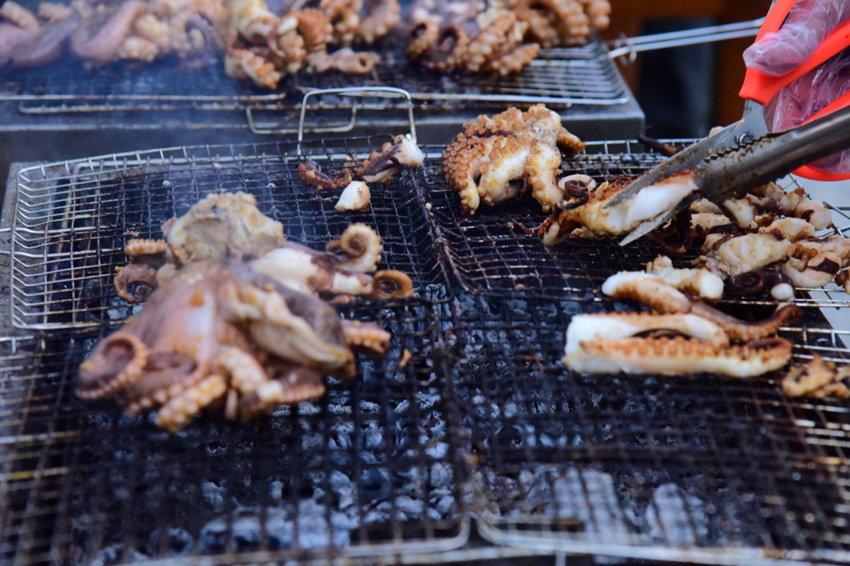 Korean street food vendor with charcoal grill