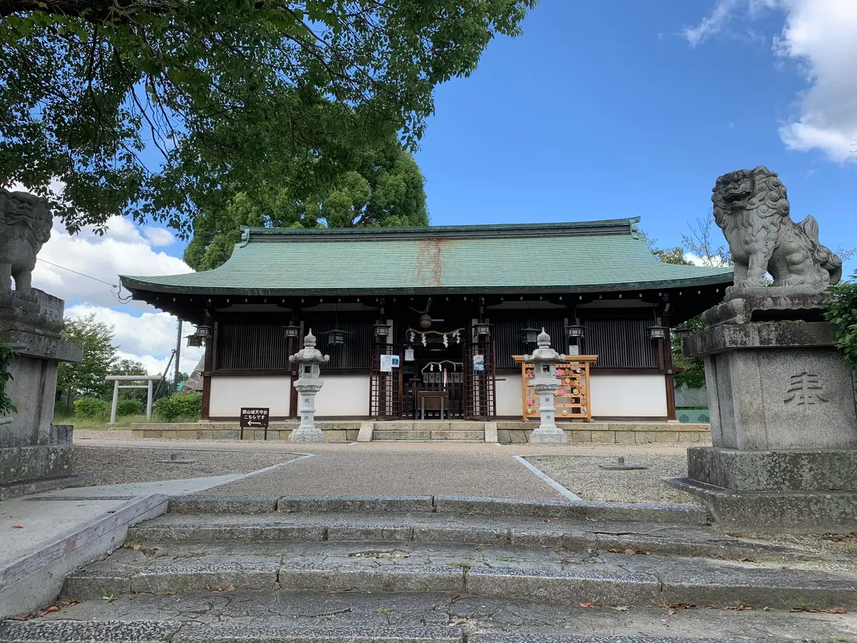 Discover the serene beauty of a traditional Shinto shrine in Japan, marked by iconic stone guardians.